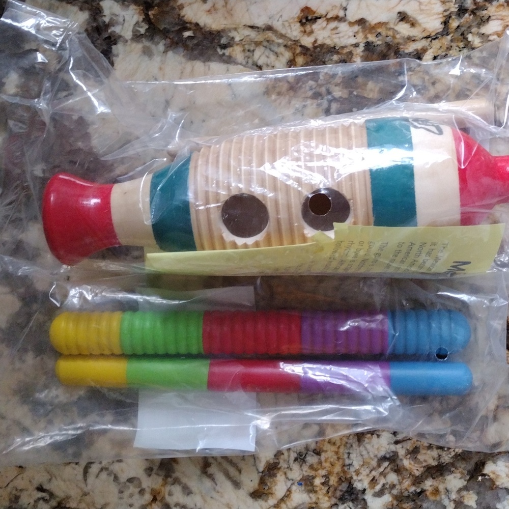 Mexican girl and colorful rhythm sticks.